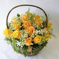 An arrangement of 12 mix roses basket
