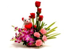6 Red Roses 4 Pink Carnations 5 Purple orchids with 6 inches Teddy in a Basket