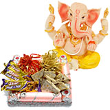 An assortment of sweets with chocolates and Ganesh idol