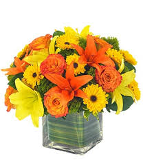 Yellow and orange lilies vase