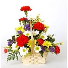 mixed assorted flowers in a hand woven basket