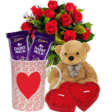 12 red roses, coffee mug 2 chocolates, teddy bear and 2 hearts