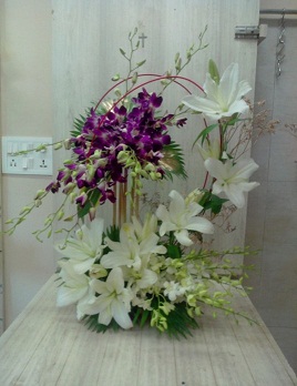 10 purple Orchids 10 white Orchids and 7 white lilies Basket