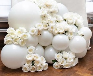 15 white small and large balloons with 50 white flowers