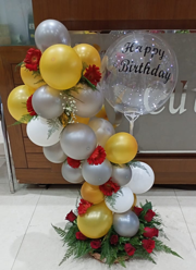 Transparent Balloon Printed Happy Birthday with gold silver and white balloon arch decorated with red gerbera flowers basket