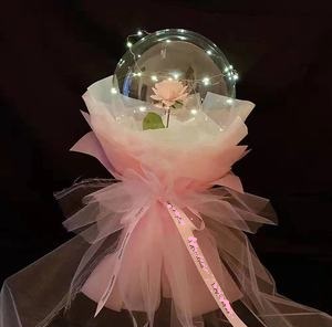 Clear transparent bubble with pink rose pink wrapping