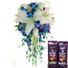 2 bubbly silk chocolates with 10 blue orchids and 2 white lilies bunch