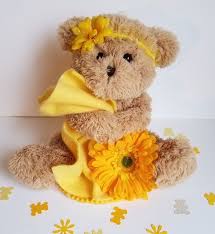White or cream 6 inch Teddy decorated with gerberas