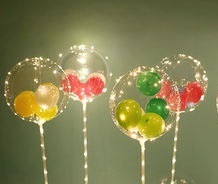 4 Transparent bobo balloons stuffed with coloured balloons with lights