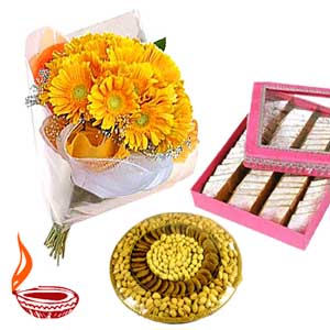 Dry fruits with kaju katli and gerberas