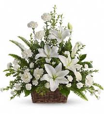 Arrangement of white carnations, roses white Liliums