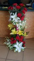 2 Feet arrangement of White  and Yellow Lilies Red Carnations and rajnigandha