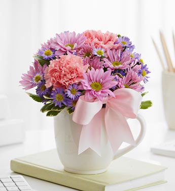 flowers in a coffee mug