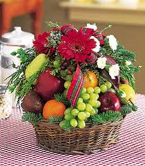 2 kg. fruits with 12 roses in a hand bouquet