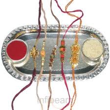 5 Rakhis, thali, roli, chawal