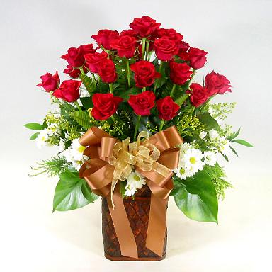 2 dozen red roses in a vase