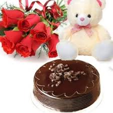 5 Red Roses 1/2 Kg Dark chocolate Cake and Teddy (6 Inches)