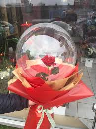 1 transparent balloon 1 red rose arrangement with red wrapping