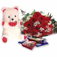 cute teddy bear with 6 red roses and 4 chocolates