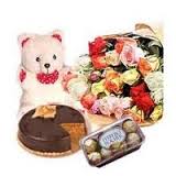 Flowers, cake, teddy bear and chocolates