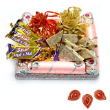 Hand made chocolates with kaju katli in a decorated tray