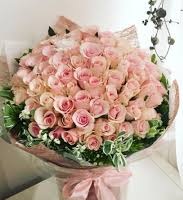 60 pretty peach roses hand bouquet brown paper wrapping