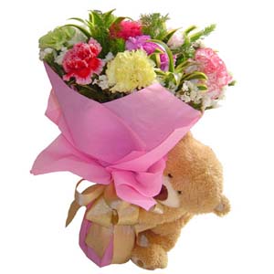 Assorted flowers with teddy