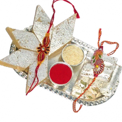 2 rakhis, silver plated thali ,250 gms kaju katli, roli, chawal