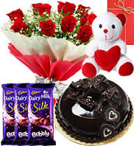 Teddy bear (6 inches) with 3 Bubbly Silk chocolates and 10 red roses bouquet 1/2 Kg chocolate cake