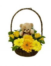 Teddy bear (6 inches) with 8 short stems of Yellow gerberas and yellow roses in the same Basket