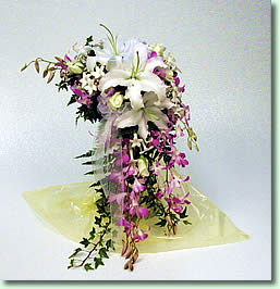 10 Purple Orchids 3 White lilies in a drooping arrangement