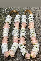 A pair of simple rose garland